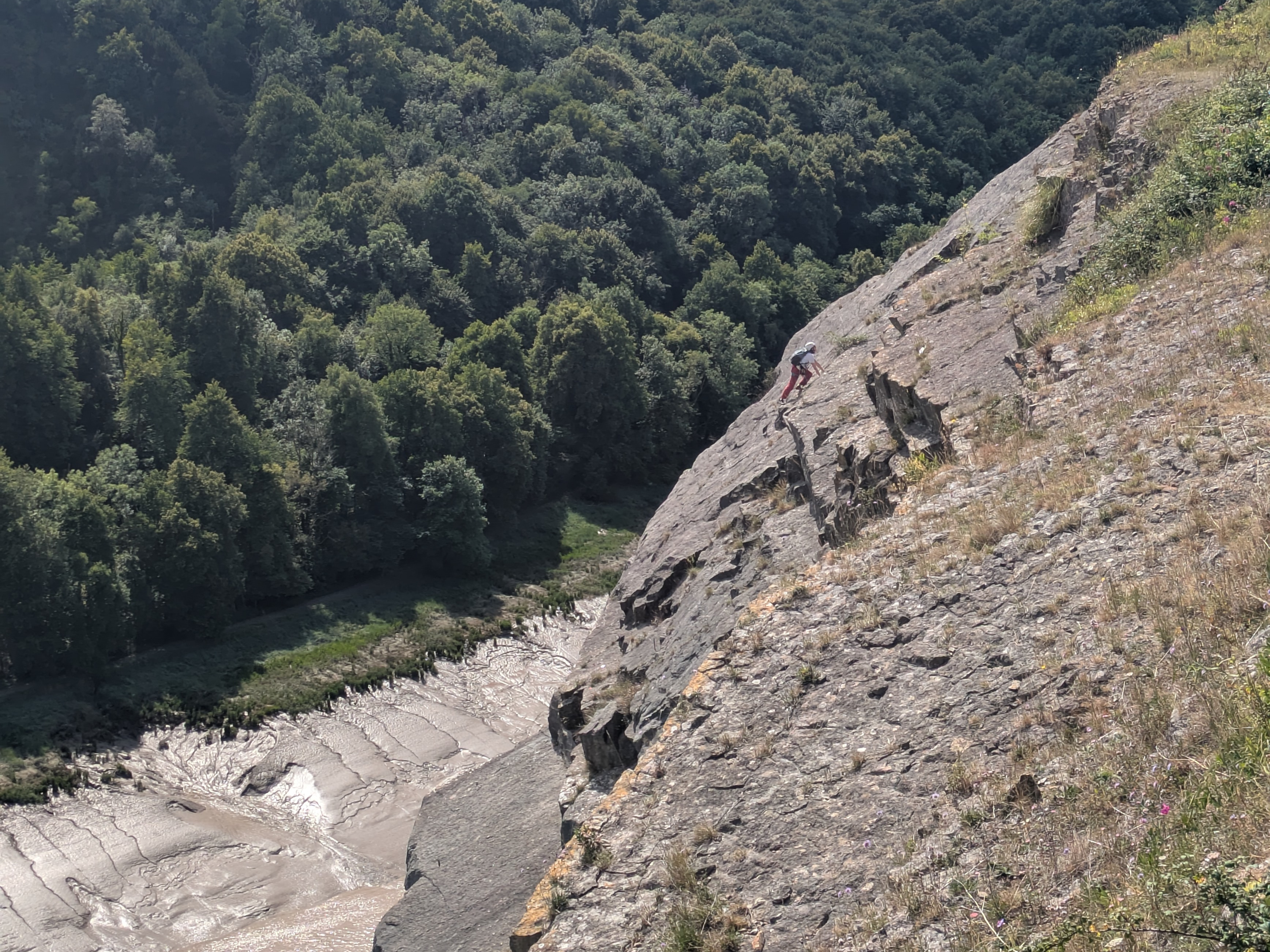 A picture of a woman on a climbing route